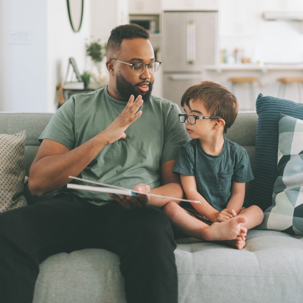 Father teaching son, fostering connection and knowledge transfer.